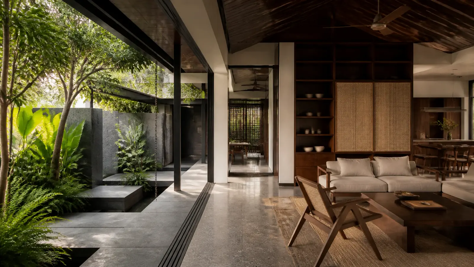 Tropical Singapore home where architectural structure and a warm, carefully planned interior meet a planted courtyard.