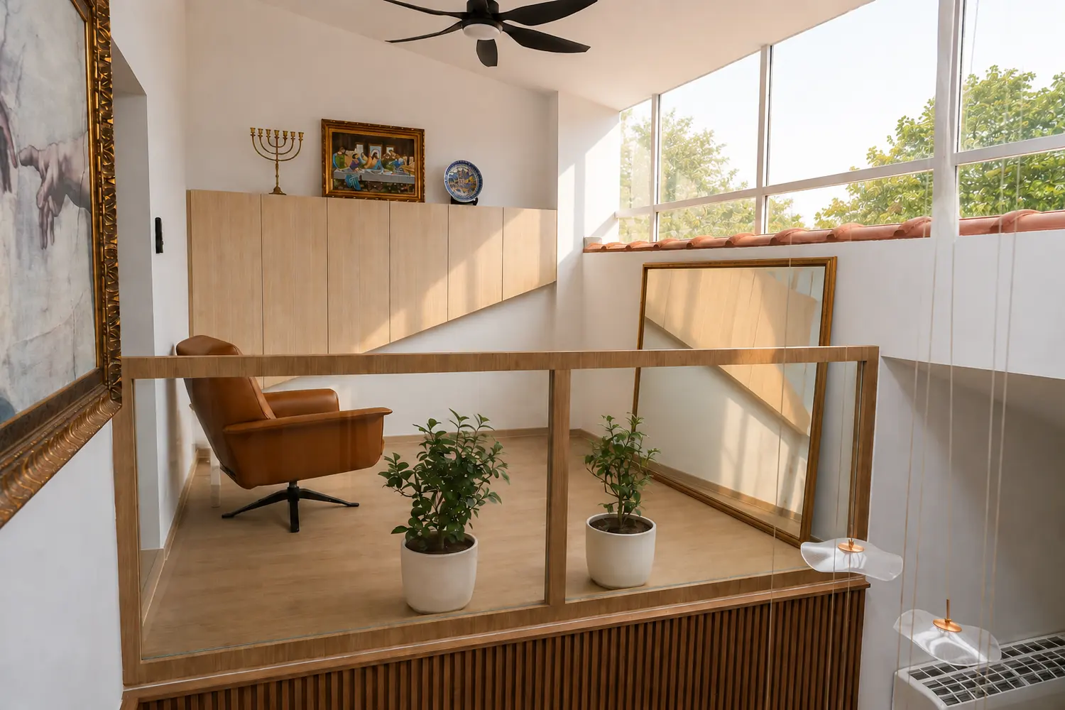 The upper landing behind glass balustrades, open to the double-height glazing